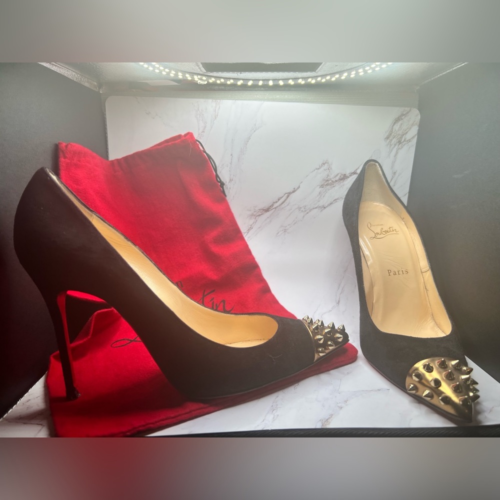 Black suede geo studded Christian Louboutin heels.